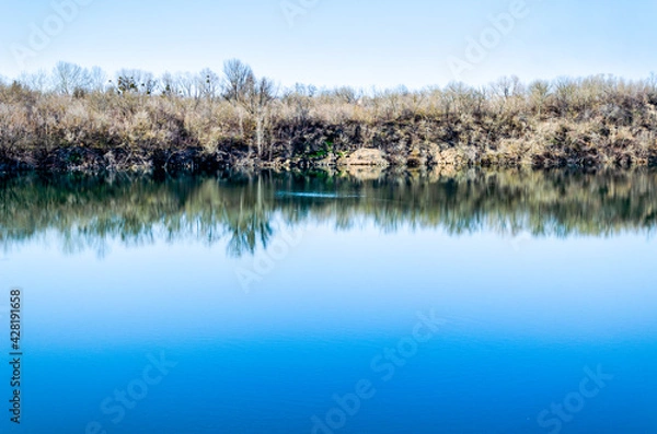 Fototapeta Smilansky sand quarry with lake in spring
