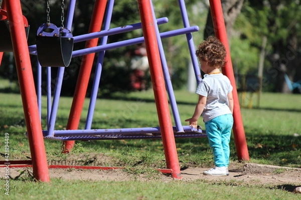 Fototapeta child playing on playground