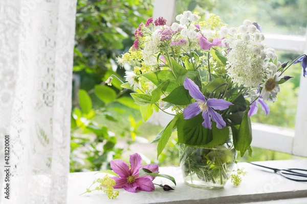 Fototapeta Bouquet on windowsill in countryside