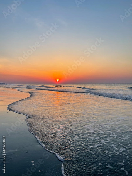 Fototapeta sunrise on the beach