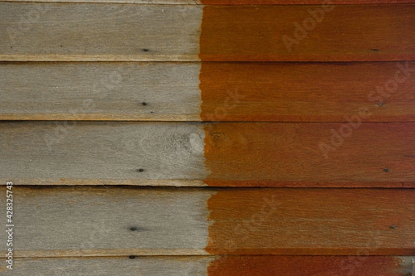 Fototapeta Background image of stained wood and natural wood color.