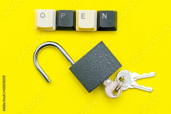 Obraz an open lock with keys on a yellow background the word open concept is laid out on top of a computer keyboard