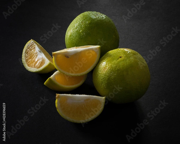 Obraz Mosambi, sweet lime on black background