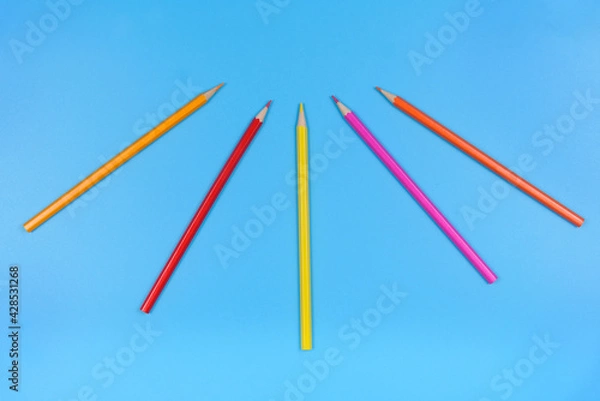 Fototapeta Five colored pencils on a blue background