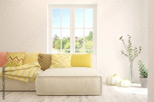 Fototapeta Stylish room in white color with sofa and summer landscape in window. Scandinavian interior design. 3D illustration