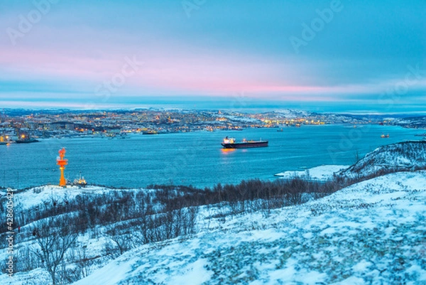 Fototapeta Murmansk, snow, Kola Bay, ships in the roads.

Murmansk seaport is the only non-freezing Northern port of Russia, and only because the Gulf Stream enters the Kola Bay (Barents Sea)
