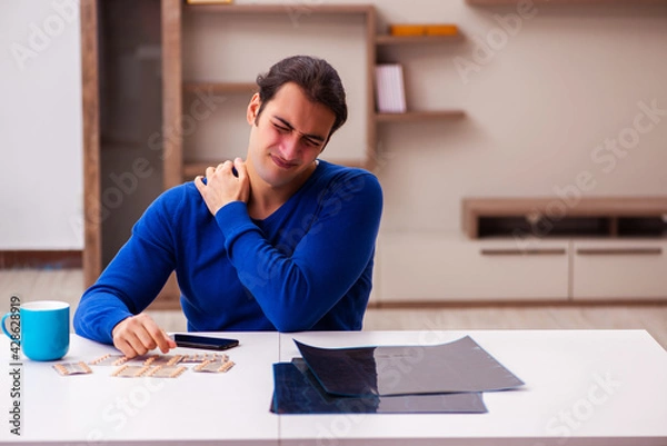 Fototapeta Young sick man suffering at home