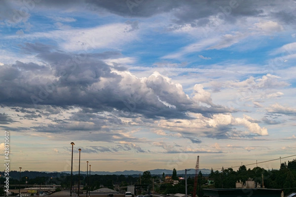 Fototapeta clouds over the city