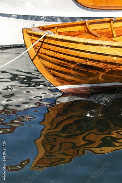 Fototapeta wooden boat, reflection in water
