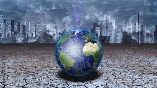 Obraz Earth sits in dried cracked mud before metropolis