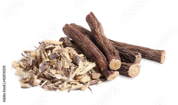 Fototapeta Dried sticks of liquorice root and shavings on white background