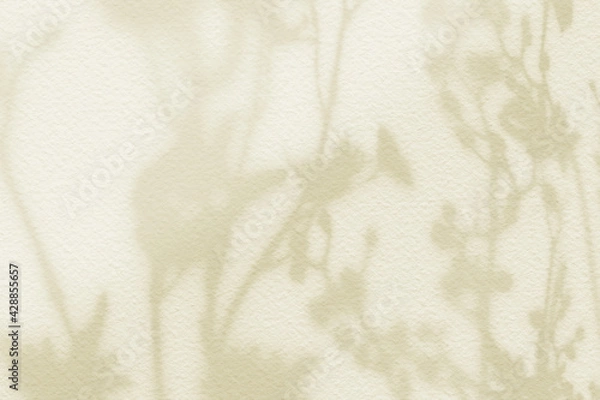 Obraz Flower shadows on light yellow pastel color wall.
