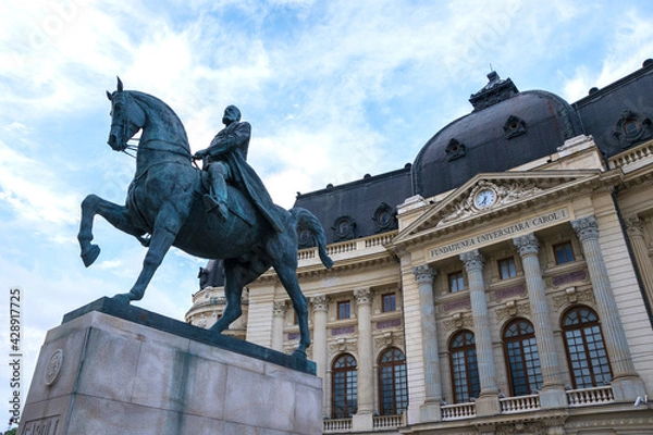 Fototapeta King Carol I equestrian statue (Statuia ecvestra a lui Carol I) and the Central University Library of Bucharest
