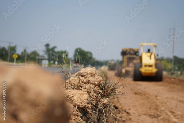 Fototapeta The image is blurred in the construction of asphalt road.