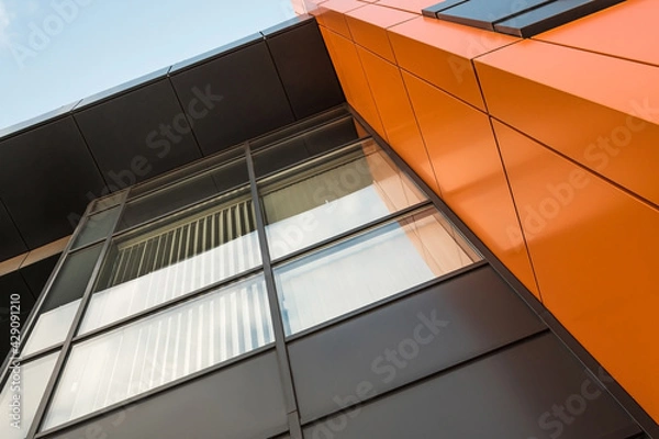 Obraz Geometric colored building facade elements with planes, lines and corners with light flare and reflections for an abstract background and texture of white, blue, gray colors. Place for text