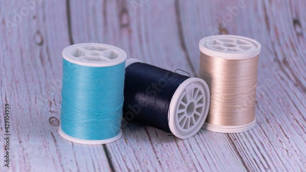 Obraz closeup of several sewing thread