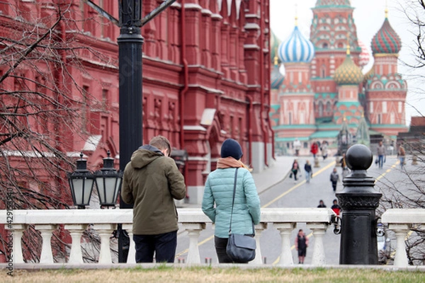 Fototapeta View to the Red square, State historical museum and St. Basil's Cathedral in Moscow. Tourists admire the sights of Russia in the spring