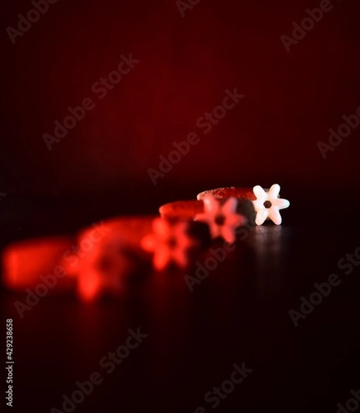 Fototapeta white plastic object with red light effects