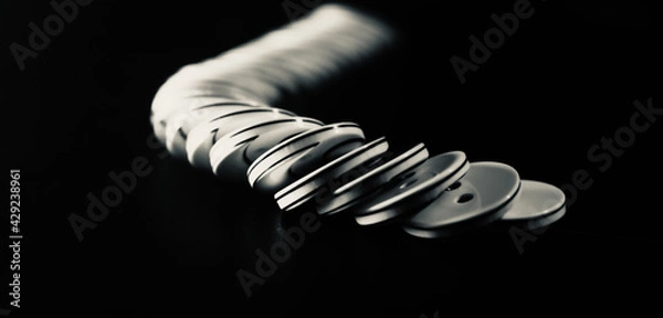 Fototapeta stack of plastic buttons black background