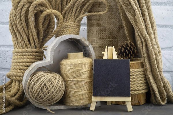 Fototapeta Assorted balls of hemp twine with rope and slate
