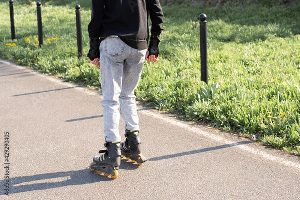 Obraz Roller skating in the park in summer.