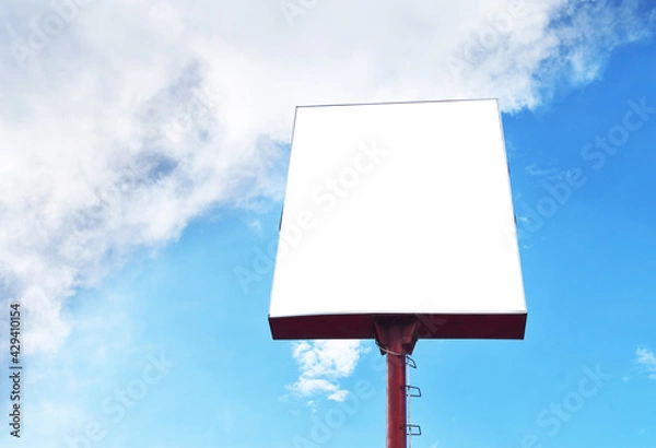 Fototapeta Blank billboard mock up against the blue sky background
