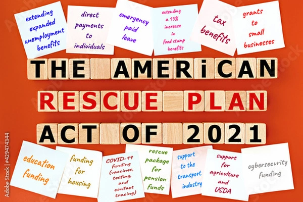 Fototapeta photo on The American Rescue Plan Act of 2021 theme. wooden cubes with the inscription "The American Rescue Plan Act of 2021", and sticky notes, on orange background