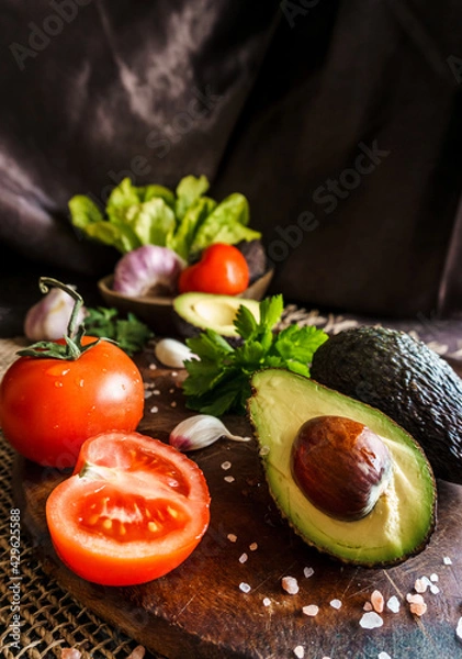 Obraz Wholemeal bread with tomato slices and avocado