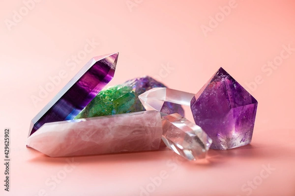 Fototapeta Faceted amethyst, rose quartz, fluorite, rock crystal, quartz cluster taken close up. Various crystals for healing and magical practices