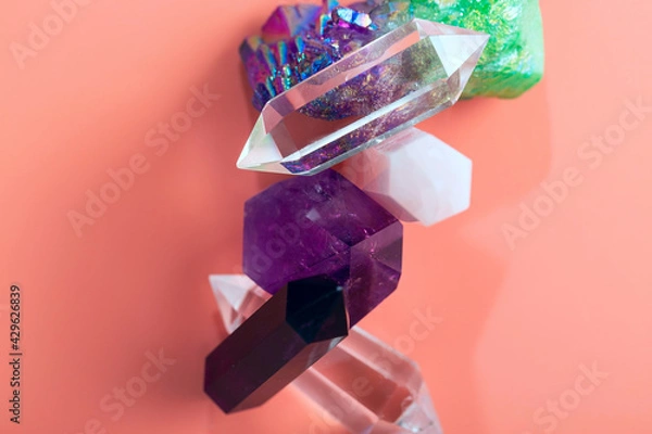 Obraz Beautiful crystals of amethyst, rock crystal, rose quartz, fluorite of various shapes and colors. Natural semi-precious stones on a pink background