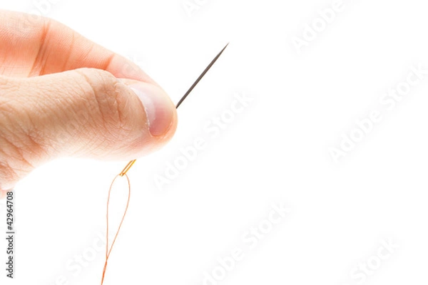 Obraz Needle and thread in hand closeup.