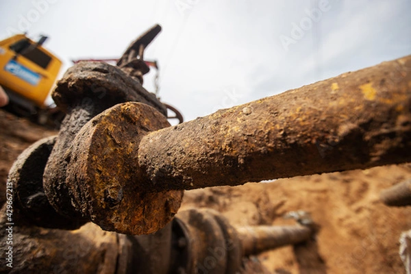Fototapeta emergency services, the repair team provides safety during the replacement of pipes, old communications are changed to new ones, the gas pipeline, the old and rusted water pipe with dirty gates, repla