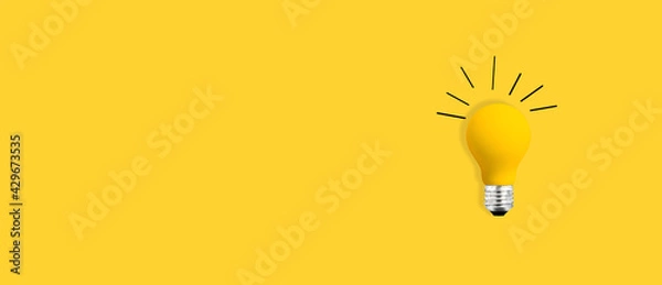 Obraz Yellow light bulb - flat lay from above