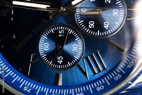 Fototapeta Macro Close Up of Complications and Roman Numeral Eight on Blue Faced Chronograph