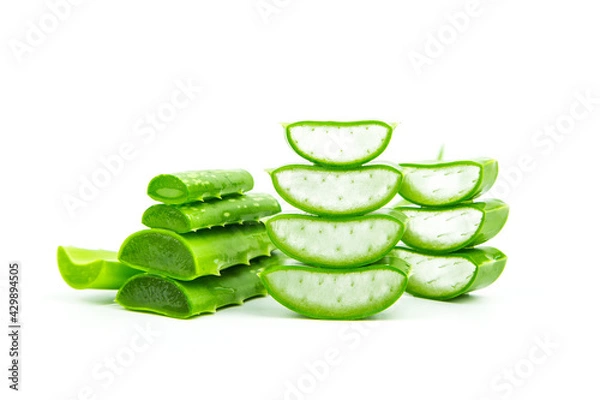 Fototapeta Aloe vera, Close-up slices of green fresh aloe vera plant stacked and aloe vera stalk or leaves with water dropping isolate on white background.