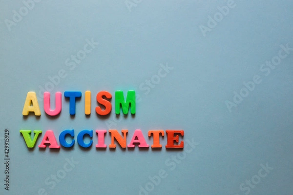 Fototapeta Autism, Vaccinate. The words are lined with letters from a plastic magnetic alphabet.