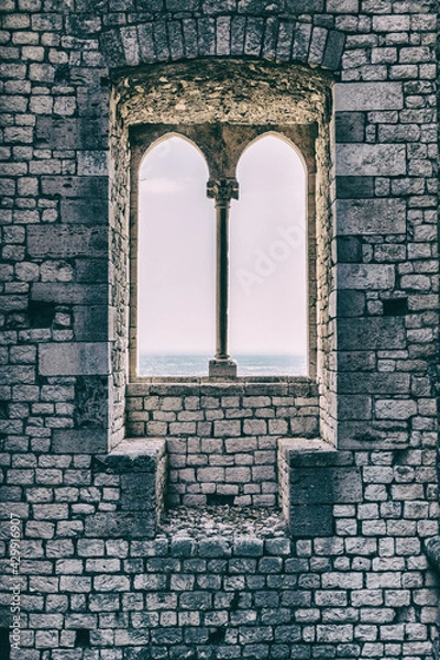 Fototapeta Old vintage window on an ancient facade. No people