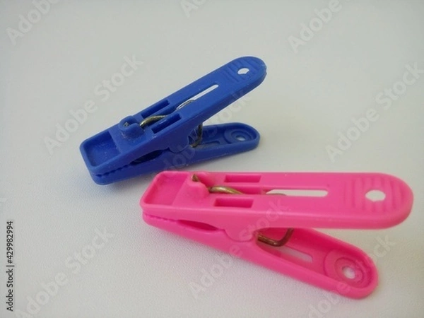 Obraz clothes pegs on a white background