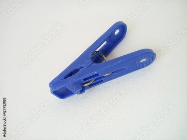 Obraz clothes pegs on a white background