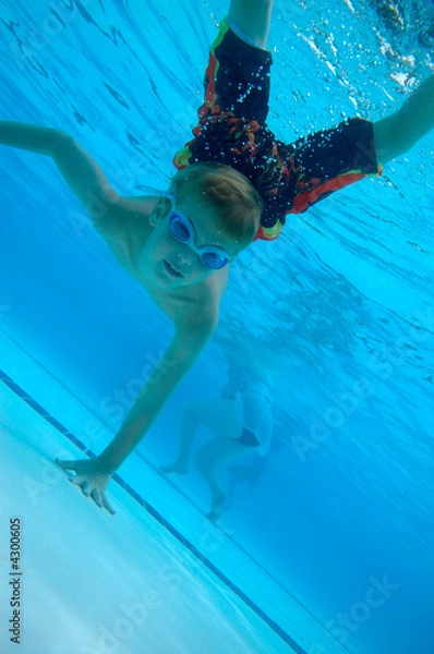 Fototapeta Boy swimming underwater