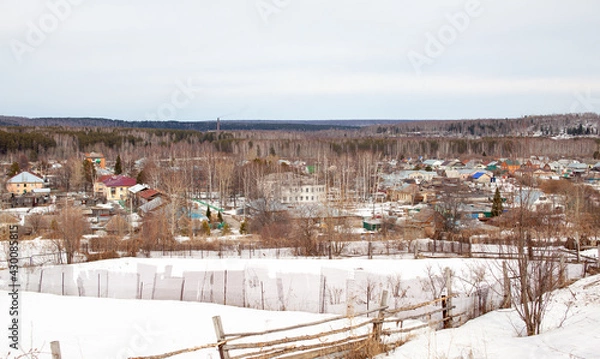 Fototapeta Lots of snow after a snow storm in winter.Houses in the snow captivity