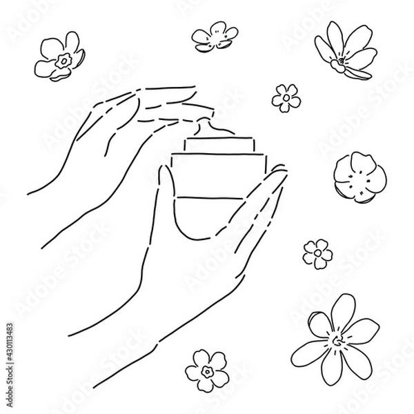 Fototapeta Cream applying. Beautiful woman hands with cream and flowers