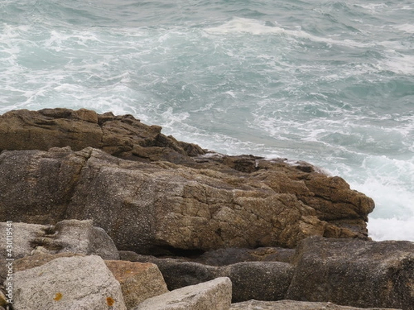 Fototapeta waves creating new forms on the rocks