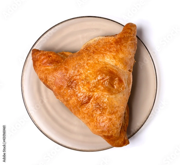 Fototapeta Samsa - Eastern food. One piece is on the plate. Isolated on white background. Top view. Close up.