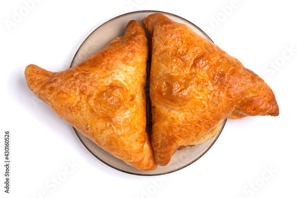 Fototapeta Samsa - Eastern food. Two pieces are on a plate. Isolated on white background. Top view. Close up.
