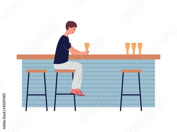 Fototapeta Sad depression man in loneliness sitting at bar counter and drinks alcohol.