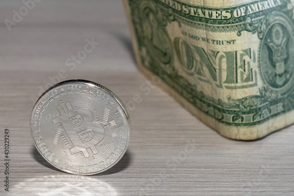 Obraz bitcoin coin on a dollar background