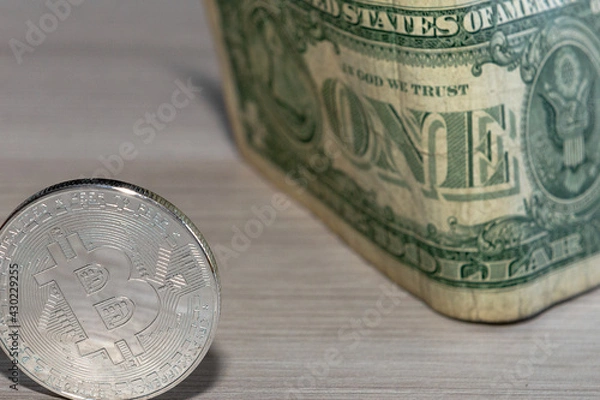 Obraz bitcoin coin on a dollar background