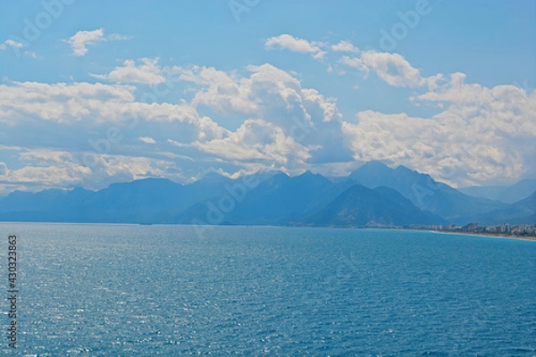 Obraz blue sky with clouds with mountains with sea 