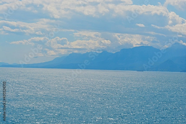 Obraz blue sky with clouds with mountains with sea 